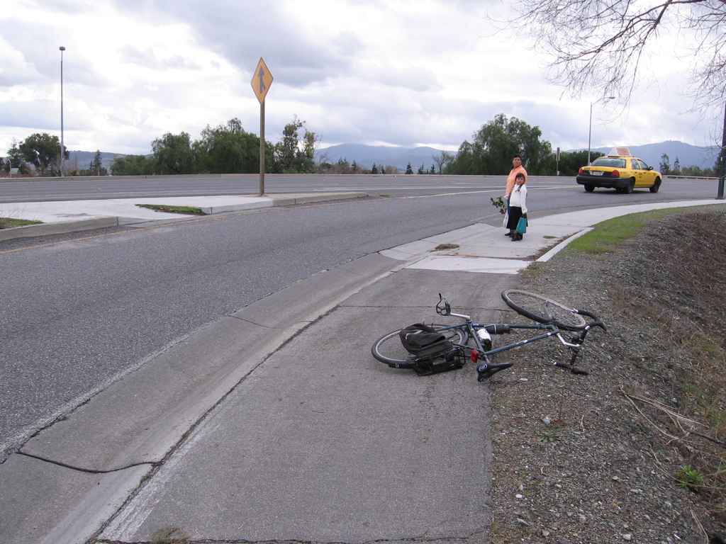 On-ramp top with unmarked crosswalk with ADA (wheelchair) access. (NE side of bridge)