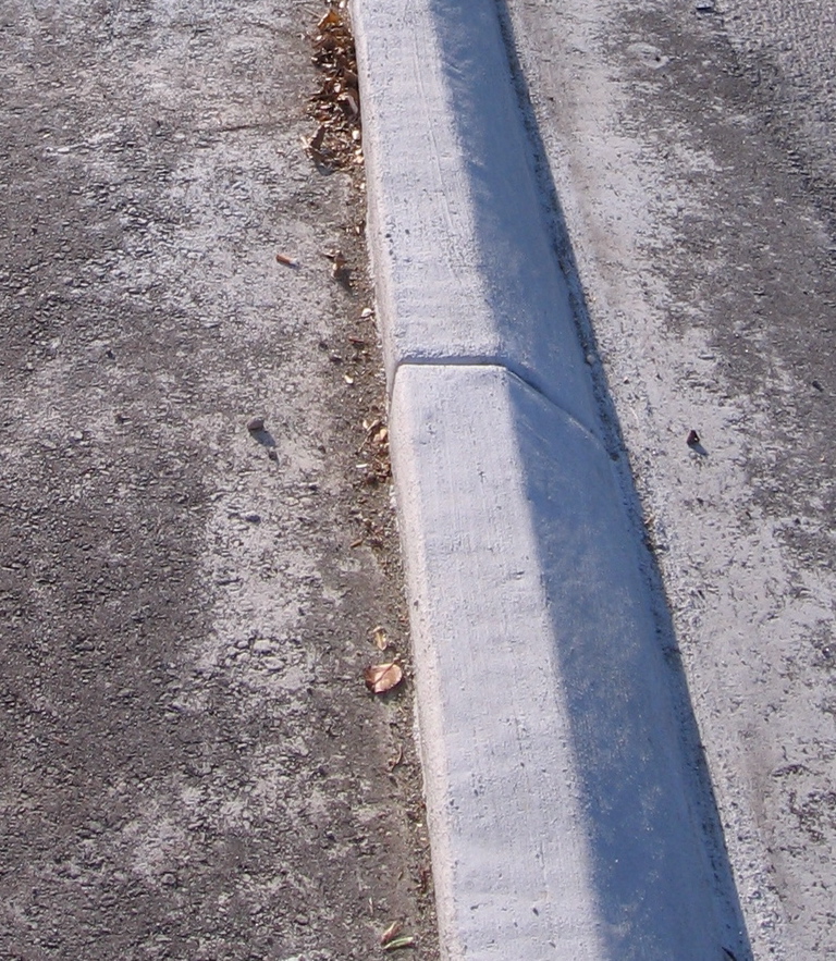 Option 3: Place a concrete berm to create a sidewalk on the bridge and ramps. (photo: Montague Expy.)