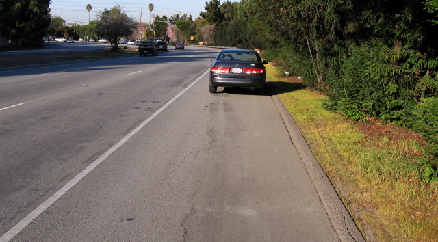 Shoulder is 9' wide beyond the intersection area. Car had stopped momentarily.