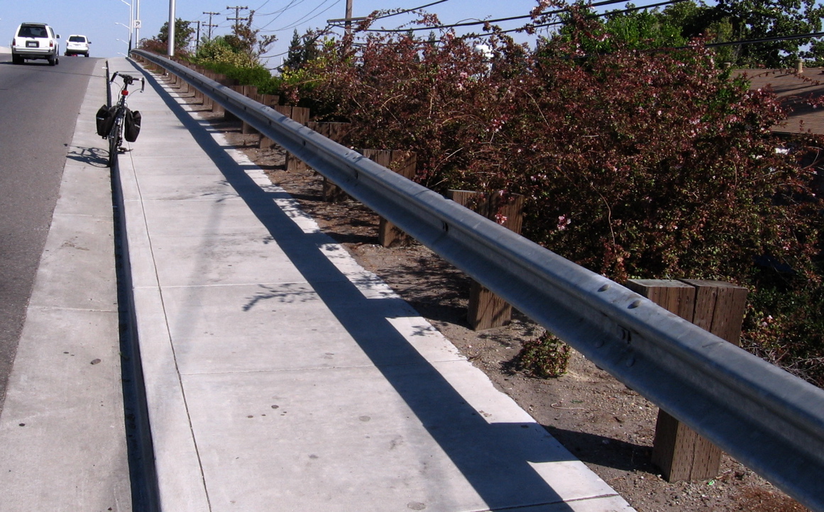 Guard rail along Scott Blvd bridge.